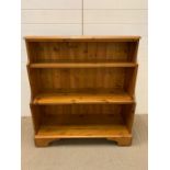 A pine waterfall bookcase (H102cm W95cm D36cm)