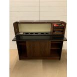 A Mid Century bar with wine bottle holders, ice bucket and serving shelf (H115cm W127cm D40cm)