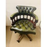 A green leather Captains chair