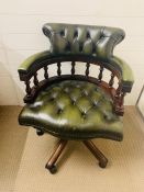 A green leather Captains chair