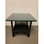 An Aesthetic movement ebonised table with glass top. (H50cm Sq55cm)