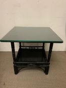 An Aesthetic movement ebonised table with glass top. (H50cm Sq55cm)