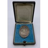 A Prussian Firemans Badge 1934-36 in original box, marked 900 silver.