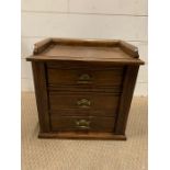 A small oak set of collectors drawers