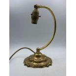 A Cast brass desk or side lamp with no shade.