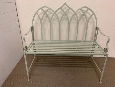 A metal garden bench painted pale green (H90cm W96cm D42cm)