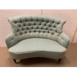 Two seater Victorian sofa on mahogany legs and castors