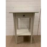 A painted white side table with drawers (H75cm W50cm D30cm)