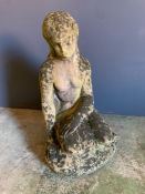 A stone garden ornament of a lady kneeling (H60cm)