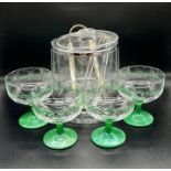 A contemporary plastic wine cooler with four glass champagne coupe
