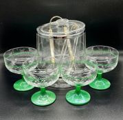 A contemporary plastic wine cooler with four glass champagne coupe