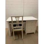 A solid painted desk and chair (H75cm W130cm D59cm)