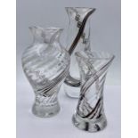 A selection of three Caithness encased glass vases