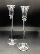 A pair of wine glasses with bell bowl raised on a long stem and plain foot (H: 30 cm). (2)