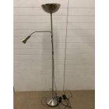 A modern chrome floor lamp