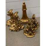 Five gold coloured decorative sconces, two pairs and a single.