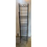 A metal shelving rack (H58cm W30cm D26cm)