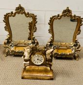 Two table standing mirrors and a mantle clock