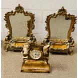 Two table standing mirrors and a mantle clock