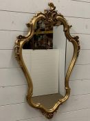 A gilt frame wall mirror (90 cm x 50 cm)