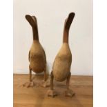 A pair of carved wooden ducks