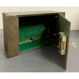 A metal wall cash safe
