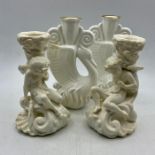 A pair of Royal Doulton Ambassador swan candle sticks and a pair of candlestick in the form of a