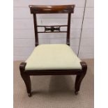 A low mahogany chair