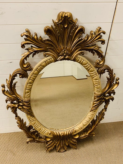 A 20th century giltwood oval mirror with floral carving - Image 4 of 7