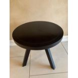 A contemporary black three legged table (H50cm Dia50cm)