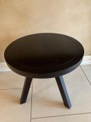 A contemporary black three legged table (H50cm Dia50cm)
