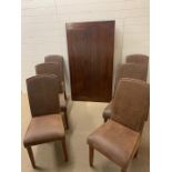 A mahogany dining table with six suede effect chairs (H77cm W160cm D90cm)