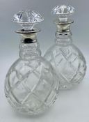 A Pair of silver collared (1964) crystal decanters.