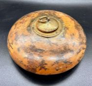 A decorative wooden inkwell or similar