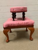 An upholstered stool raised on cabriole legs ending in pad feet along with a mahogany footstool,