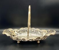 A silver pierced bowl with handle, total weight 415g, hallmarked for Sheffield 1918 by R F