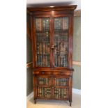 A Theodore Alexander corner unit in the style of library bookcase (H237cm W105cm D58cm)