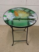 A small folding side table with stained glass top with a robin (H50cm Dia35cm)