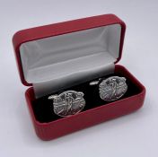 A Pair of silver cufflinks of Golfing interest