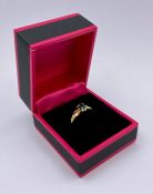 A 10 ct yellow gold Emerald set ring. Size N