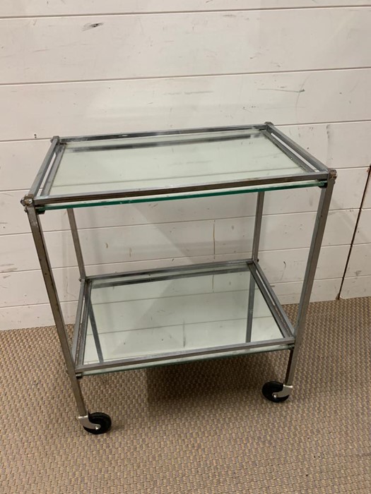 A metal and mirrored industrial style trolley (H63cm W51cm D34cm)