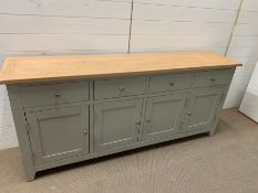 A long contemporary sideboard with drawers and cupboards under (H86cm W190cm D43cm)