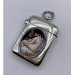 A Silver Vesta case with a nude enamel plaque