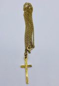 A 9ct gold cross and chain (2.8g)