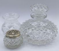 Three cut glass dressing table pots one with a hallmarked silver top