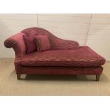 A small chaise longue with scrolled end and pink wave upholstery (H90cm W170cm D87cm)