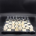 An onyx chess set to include a chess board and 32 pieces