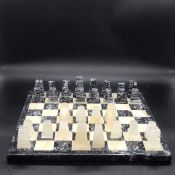 An onyx chess set to include a chess board and 32 pieces