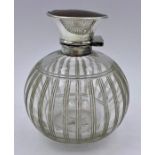 A Hallmarked silver and tortoiseshell topped scent bottle