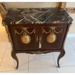 A French Louis style marble top cabinet on stand, decorated with foliate and figural mounts,